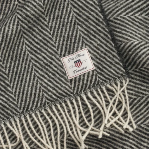 Herringbone ullpledd fra gant i svart